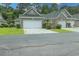 Charming townhome featuring a two-car garage, well-maintained landscaping, and inviting curb appeal in a desirable community at 750 Pinehurst Ln. # 84A, Pawleys Island, SC 29585