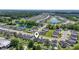 Expansive aerial view of a neighborhood with peaceful ponds and modern homes nestled in a serene environment at 751 Dusty Pine Way, Myrtle Beach, SC 29588