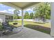 Backyard with a trampoline, grill, seating, and expansive green space, perfect for outdoor activities at 751 Dusty Pine Way, Myrtle Beach, SC 29588