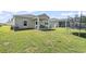 Spacious backyard featuring a patio, trampoline, and plenty of green space for recreation at 751 Dusty Pine Way, Myrtle Beach, SC 29588