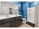 Bathroom featuring double sinks, a spacious shower, and ample storage space, offering convenience and style at 751 Dusty Pine Way, Myrtle Beach, SC 29588