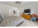 Bedroom with carpet, TV, hardwood floors outside the room, and dresser at 751 Dusty Pine Way, Myrtle Beach, SC 29588