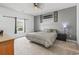 Bedroom with decorative wall art, neutral carpet, and ample lighting at 751 Dusty Pine Way, Myrtle Beach, SC 29588