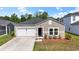 Charming single-story home featuring a one-car garage, neutral siding, and a well-maintained landscaped front yard at 751 Dusty Pine Way, Myrtle Beach, SC 29588