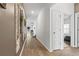 Hallway featuring wood flooring, neutral paint, decor, and doorways to other rooms at 751 Dusty Pine Way, Myrtle Beach, SC 29588