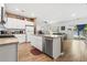 Open kitchen design with a granite island, white cabinetry and a stainless steel dishwasher at 751 Dusty Pine Way, Myrtle Beach, SC 29588
