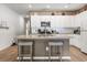 A kitchen with white cabinets, granite countertops, and stainless steel appliances at 751 Dusty Pine Way, Myrtle Beach, SC 29588