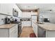 Spacious kitchen featuring granite countertops, gas range, stainless steel appliances, and white cabinets at 751 Dusty Pine Way, Myrtle Beach, SC 29588