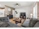 Living room showcasing neutral color pallet, ceiling fan, wood flooring, comfortable couches and flat screen TV at 751 Dusty Pine Way, Myrtle Beach, SC 29588