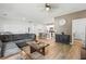 A living room that opens to a kitchen with breakfast bar seating, and modern decor at 751 Dusty Pine Way, Myrtle Beach, SC 29588