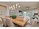 Elegant dining room with a rustic wooden table and stylish chandelier at 812 Maltby Alley, Myrtle Beach, SC 29588