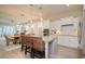 Open-concept kitchen with granite countertops and stainless steel appliances overlooking dining area at 812 Maltby Alley, Myrtle Beach, SC 29588