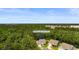 Aerial view of a charming home surrounded by lush greenery in a serene neighborhood at 818 Mourning Dove Dr., Myrtle Beach, SC 29577
