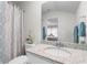 Bright bathroom featuring a single sink vanity and decorative shower curtain at 818 Mourning Dove Dr., Myrtle Beach, SC 29577