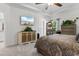 Cozy bedroom featuring a ceiling fan, patterned bedding, a dresser, a mirror, and neutral decor at 818 Mourning Dove Dr., Myrtle Beach, SC 29577