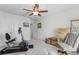 Bright, carpeted bedroom with ceiling fan, exercise equipment and moving supplies at 818 Mourning Dove Dr., Myrtle Beach, SC 29577