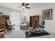 Bedroom with exercise equipment, neutral tones and a ceiling fan at 818 Mourning Dove Dr., Myrtle Beach, SC 29577
