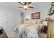 Bedroom featuring a bed with a patterned cover, bedside tables, and ceiling fan at 818 Mourning Dove Dr., Myrtle Beach, SC 29577