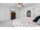 Bright bedroom with a ceiling fan, neutral tones, and ample storage and closet space at 818 Mourning Dove Dr., Myrtle Beach, SC 29577