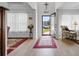 Inviting foyer with wood floors, a decorative rug, and an open doorway, creating a warm welcome at 818 Mourning Dove Dr., Myrtle Beach, SC 29577