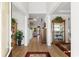 Spacious foyer featuring wood floors, neutral walls, and elegant decor, creating an inviting entrance at 818 Mourning Dove Dr., Myrtle Beach, SC 29577