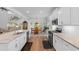 Bright kitchen featuring white cabinets, granite countertops, and stainless steel appliances open to the dining area at 818 Mourning Dove Dr., Myrtle Beach, SC 29577