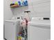Bright laundry room featuring a modern washer and dryer, shelving and storage at 818 Mourning Dove Dr., Myrtle Beach, SC 29577