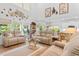 Bright living room with neutral tones, comfortable seating, and an open floor plan leading to outdoor views at 818 Mourning Dove Dr., Myrtle Beach, SC 29577