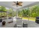 Cozy screened-in porch with stylish furniture and a ceiling fan, creating a relaxing outdoor space at 818 Mourning Dove Dr., Myrtle Beach, SC 29577