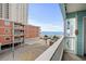 View from balcony looking out to beach and ocean at 824 N Waccamaw Dr. # 204, Murrells Inlet, SC 29576