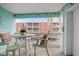 Balcony with seating overlooking other condos at 824 N Waccamaw Dr. # 204, Murrells Inlet, SC 29576