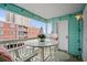 Balcony with seating overlooking other condos and ocean view at 824 N Waccamaw Dr. # 204, Murrells Inlet, SC 29576