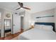 Bright bedroom features wood floors, neutral walls, and nautical-themed decor at 824 N Waccamaw Dr. # 204, Murrells Inlet, SC 29576