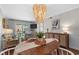Open-concept dining area flows into the living room and offers balcony access at 824 N Waccamaw Dr. # 204, Murrells Inlet, SC 29576