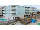 Multi-story condo building offering a swimming pool and beach access at 824 N Waccamaw Dr. # 204, Murrells Inlet, SC 29576