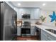 Kitchen featuring stainless steel appliances, including an oven, microwave and refrigerator at 824 N Waccamaw Dr. # 204, Murrells Inlet, SC 29576
