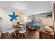 Living and dining area showcasing stylish decor, table, and patio access at 824 N Waccamaw Dr. # 204, Murrells Inlet, SC 29576