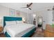 Main bedroom with a large bed, ceiling fan, and ensuite access at 824 N Waccamaw Dr. # 204, Murrells Inlet, SC 29576