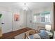 Sitting area featuring wood-look floors, wainscotting and stylish furnishings at 824 N Waccamaw Dr. # 204, Murrells Inlet, SC 29576
