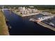 Stunning aerial view of a waterfront resort, marina, and bridge, surrounded by lush greenery at 8352 Cape Dutch Loop, Myrtle Beach, SC 29572