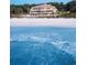 Luxurious resort overlooking a pristine beach with clear blue water, providing a serene coastal escape at 8352 Cape Dutch Loop, Myrtle Beach, SC 29572