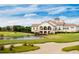 Elegant clubhouse overlooking a scenic golf course with lush green fairways and a tranquil pond at 8352 Cape Dutch Loop, Myrtle Beach, SC 29572