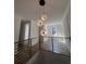 Bright hallway with decorative lighting and wood-look flooring, showcases an open layout at 5009 Middleton Dr., Myrtle Beach, SC 29579