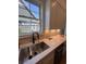 Kitchen featuring sleek countertops, modern sink, herringbone backsplash, and contemporary cabinets at 5009 Middleton Dr., Myrtle Beach, SC 29579