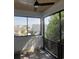 Relaxing screened patio with ceiling fan and beautiful views of neighborhood houses and lush tropical landscaping at 5009 Middleton Dr., Myrtle Beach, SC 29579