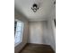 An open room with decorative paneling and LVP floors is filled with natural light at 5009 Middleton Dr., Myrtle Beach, SC 29579