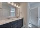 Stylish bathroom featuring double sinks, granite countertops, and a large mirror at 905 Monmouth Dr., Myrtle Beach, SC 29588