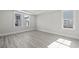 Well-lit bedroom with wood floors, neutral paint, and large windows offering plenty of natural light at 905 Monmouth Dr., Myrtle Beach, SC 29588