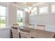 Elegant dining room showcasing neutral walls, and large windows offering lots of natural light at 905 Monmouth Dr., Myrtle Beach, SC 29588