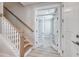 Bright entryway featuring wood stairs, white trim and an office with double glass doors at 905 Monmouth Dr., Myrtle Beach, SC 29588